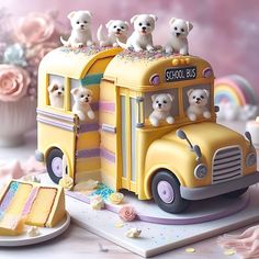 a cake shaped like a school bus with puppies on top