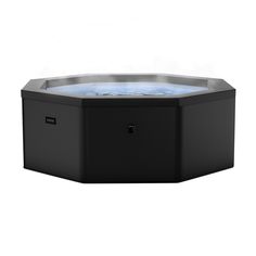 an outdoor hot tub with blue light inside