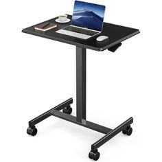 a laptop computer sitting on top of a black stand up desk with wheels and casters