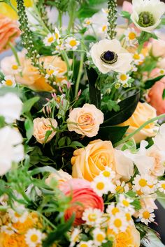 a bunch of flowers that are sitting on a table