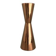 a copper colored vase on a white background