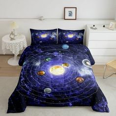 this is a bed with an image of the solar system on it