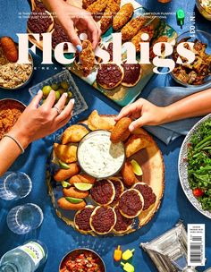 people sitting at a table with food and drinks on the cover of newsies magazine