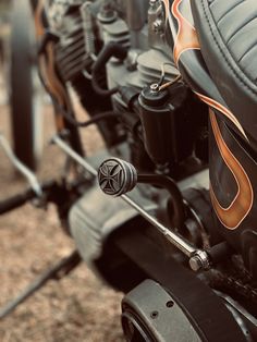 the front end of a motorcycle with an orange flame on it