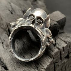 "Add a touch of edgy elegance to your style with our handcrafted 925 sterling silver ring featuring intricately detailed skull and jackal figures. The eyes are adorned with black and white zircon stones, adding a captivating sparkle. This unique piece is perfect for those who appreciate distinctive jewelry that makes a statement. Each ring is meticulously crafted to ensure both quality and style.\"Sterling silver ring, skull, jackal, zircon eyes, 925 silver, handmade jewelry, unique design, statement piece\"   *Our product is made of 925 sterling silver   *925 carat product is colored with oxide. Photos were taken in oxidized form   *You can order in oxide silver, colors   *Our ring will be sent in a velvet ring box and a bubble envelope to avoid damage during delivery.   *Please contact u Cool Rings, Rings Gothic, Edgy Elegance, Velvet Ring Box, Ring Stone, Boho Ring, Jewelry Unique, Men's Ring, Boho Rings