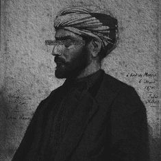 a black and white photo of a man wearing a turban