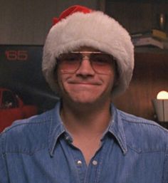 a man wearing a santa hat and glasses