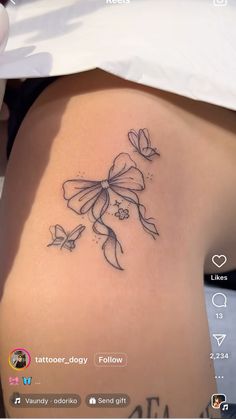 a woman's thigh with flowers on it and the words tattoo - doggy follow