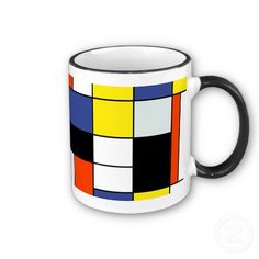 a black and white coffee mug with multicolored squares on the outside of it