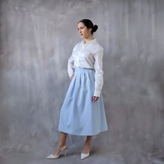 Light blue midi pleated skirt, vintage linen midi skirt, 80s light blue skirt, 70s skirt, formal coquette skirt, linen skirt, high waisted skirt. Beautiful and romantic light blue midi skirt for a dreamy vintage look. Can work for a  ⊁ It is a light blue linen blend skirt.  ⊁ Midi length. ⊁ The skirt is pleated at the front but not at the back. ⊁ It is not too flared, the skirt is between flared and a pencil skirt. ⊁ It has a single pocket, only on one side.  ⊁ Zipper at the side with a button c Coquette Skirt, Formal Skirts, Light Blue Skirt, Midi Pleated Skirt, Light Blue Skirts, 80s Skirt, 1950s Skirt, 70s Skirt, Linen Midi Skirt