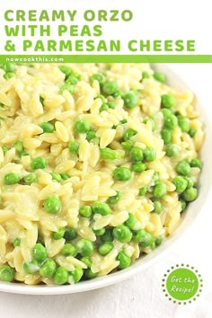 creamy orzo with peas and parmesan cheese in a white bowl on a table