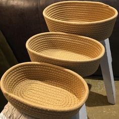 three woven baskets sitting on top of a table