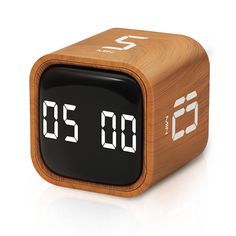 a wooden alarm clock with the numbers twenty and thirty on it's face, in front of a white background