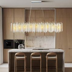 a modern kitchen with marble counter tops and bar stools