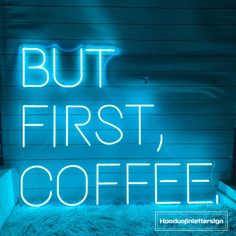 a neon sign that says but first, coffee