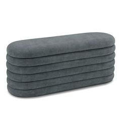 four grey pillows stacked on top of each other