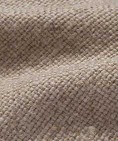 the texture of an upholstered fabric is shown in this closeup photo,