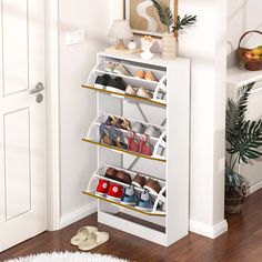 a white shoe rack filled with pairs of shoes