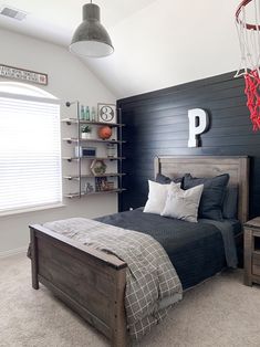 a bedroom with black walls and white carpet