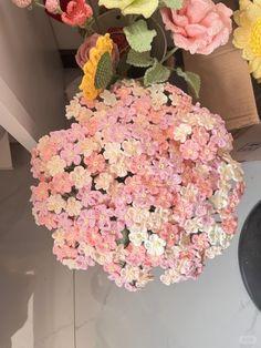 a bunch of flowers that are sitting on a table