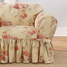 a chair with a flowered cover on it