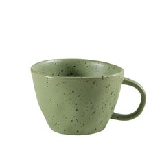 a green coffee cup with black speckles on it