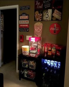 a room with some signs on the wall and food items on display in front of it