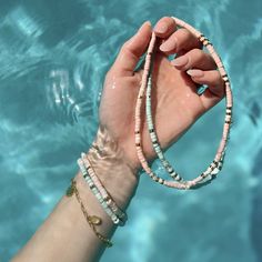 Bring alllllll the beach vibes anywhere you go with our Sealife Necklace. This beaded beauty comes in two sweet shades—a sand-inspired pink and sea-inspired turquoise—plus pops of silver or gold for a mini dose of shine. - Turquoise: brass base with rhodium plating & synthetic howlite beads- Sand: brass base with gold plating & synthetic howlite beads- Chain: 14" with 2" extension. Jump ring at 1" of extension.- Because jewelry products are handcrafted by artisans, dimensions may vary from piece Trendy Letter Beads Jewelry For Beach Season, Trendy Jewelry With Letter Beads For Beach Season, Trendy Pink Jewelry For Beach Season, Summer Everyday Beaded Jewelry, Trendy Turquoise Beaded Bracelets For Summer, Trendy Single Strand Summer Jewelry, Summer Beaded Everyday Jewelry, Everyday Summer Beaded Jewelry, Summer Bohemian Heishi Beads Jewelry