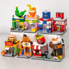 legos are stacked on top of each other to display food and drink related items