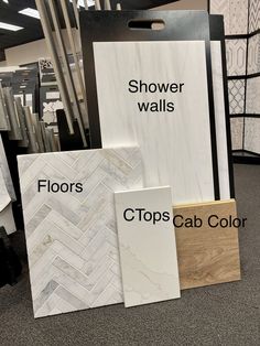 the flooring store has several different types of tile and wood in their display cases