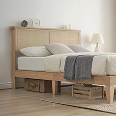 a bed sitting on top of a wooden frame