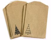 three brown paper bags with christmas trees on them