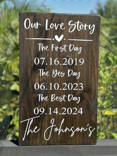 a wooden sign that says our love story the first day and the best day in the year