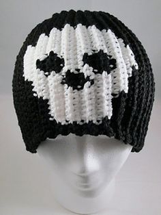 a white and black knitted skull hat on top of a head