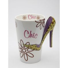 a coffee cup with a high heeled shoe on the side and words chic painted on it