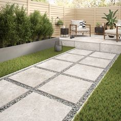 an outdoor patio area with grass and plants