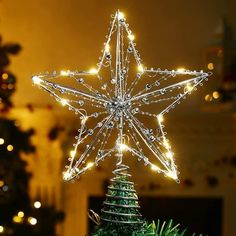 a lighted christmas tree topper in the shape of a star