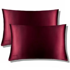 two red pillows sitting next to each other