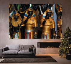 a living room scene with focus on the couch and two large gold statues in the background