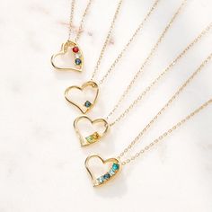 Accessorize with a little love. Three sweet birthstones are embedded in the side of this gold open heart pendant. Lovely necklace comes on a gold chain. Coordinates Jewelry, Jewelry For Kids, Heart Shaped Pendant, Monogram Jewelry, Valentines Day Gifts For Her, For Your Love, Cz Stud Earrings, Birthstone Pendant, Tiny Heart