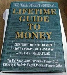 the wall street journal's life - time guide to money is shown in this photo