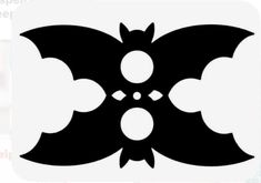 a black and white image of a bat with four bats on it's wings