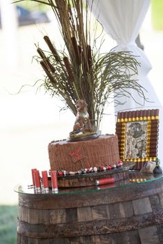 a cake sitting on top of a wooden barrel