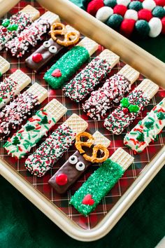 decorated cookies and pretzels are arranged on a tray