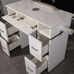 a white desk with drawers underneath it