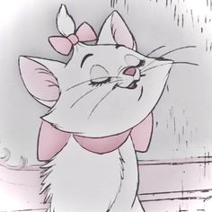 an animated image of a cat with a bow on its head