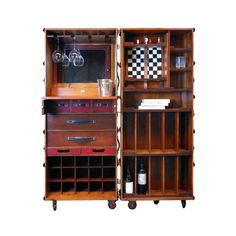 an open bookcase with wine glasses and bottles