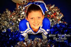 a young boy in blue and white cheerleader outfit with silver tinsel around him