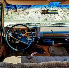 the interior of a vehicle with dashboard and steering wheel