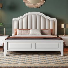 a white bed sitting on top of a wooden floor next to a dresser and mirror